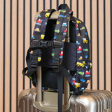 kids backpack strapped on to a suitcase